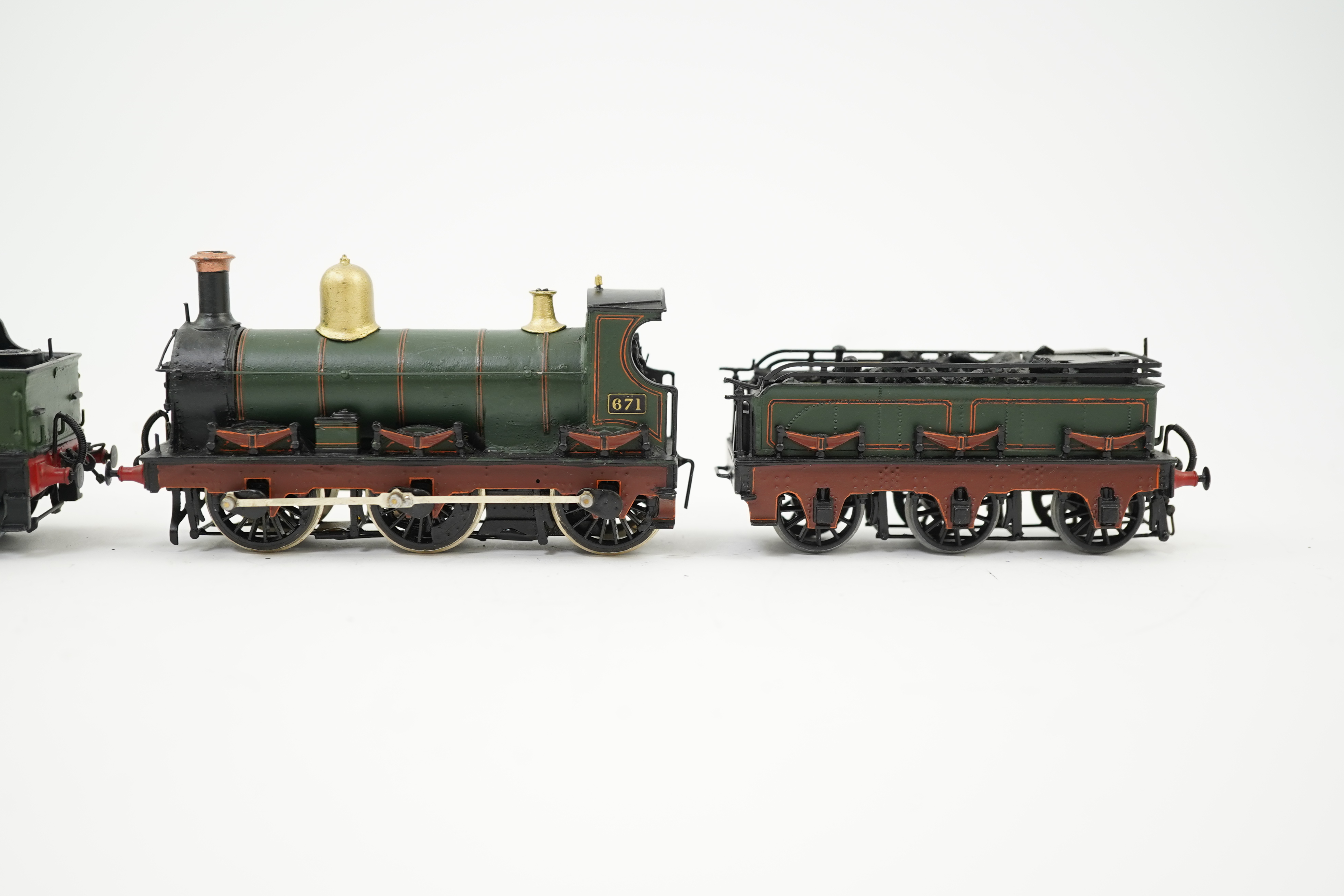 Two 00 gauge brass and white metal kit built GWR tender locomotives; an Armstrong 0-6-0, 671, together with an Earl class 4-4-0, Earl of Berkeley 3217, constructed, painted and lined to a high standard, both motored for